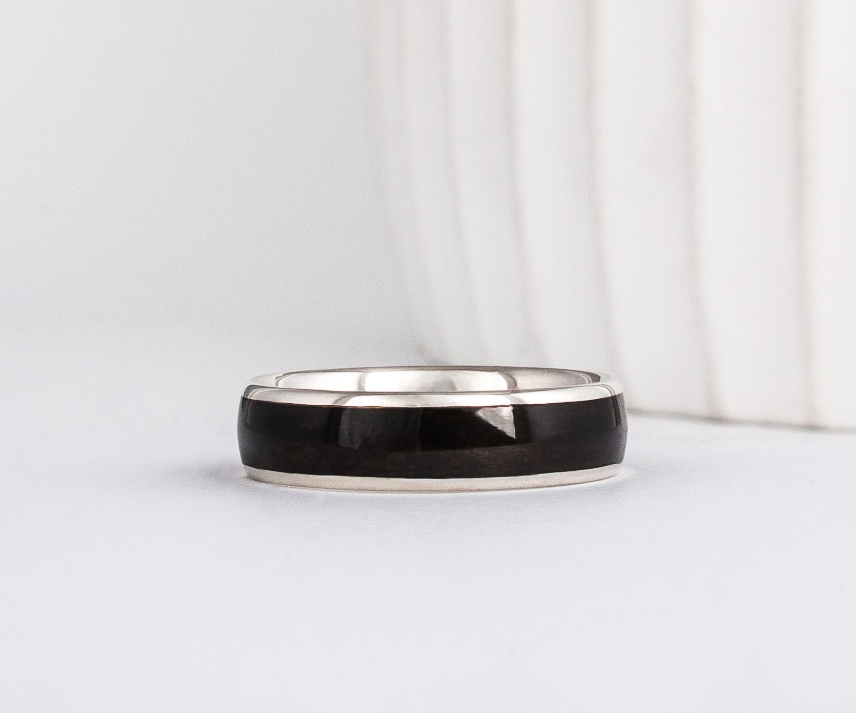 mens black wedding ring made from recycled white gold and ebony wood inlay