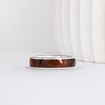 a men's wooden ring in white gold and featuring a walnut burl wood inlay