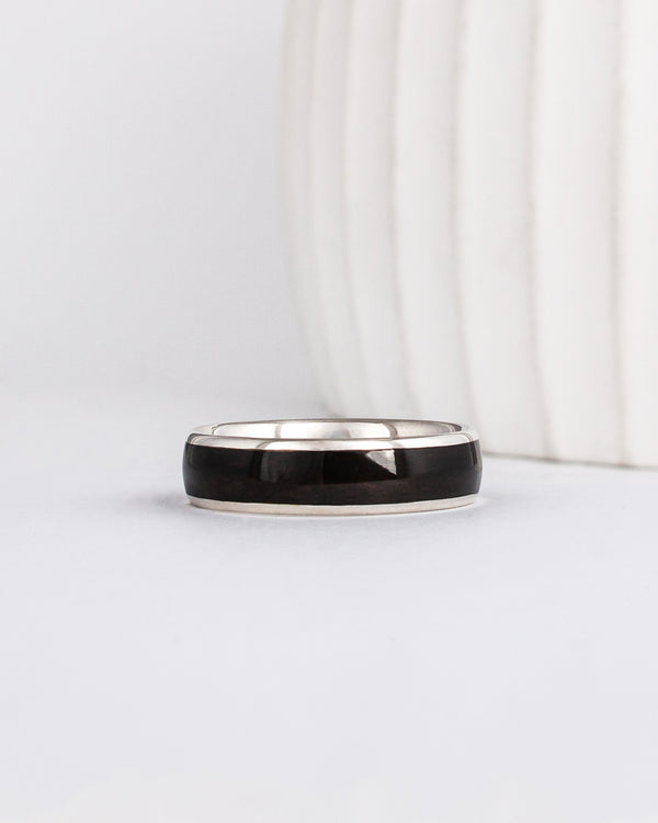 mens black wedding ring made from recycled white gold and ebony wood inlay