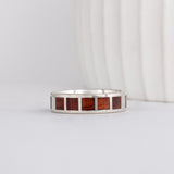 white gold modern flat profile band with Santos rosewood inlay in square patterns around band